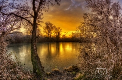 Dawn on frozen lake