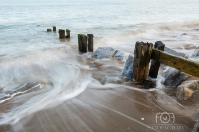 Groynes at dusk on an ebb tide