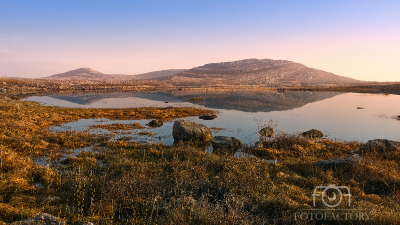 Mullaghmore mountain reflected in Lake at Burren National Park in county Clare, Ireland, nature background